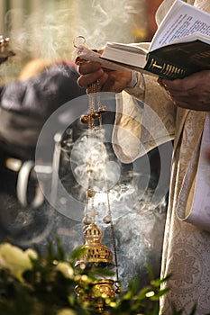 A metal vessel used in the liturgical practice of the Orthodox and Catholic Churches to perform incense