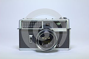 Metal vintage camera on white background