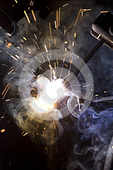 Metal welding sparks flash smoke