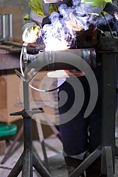 Metal welding with sparks and smoke