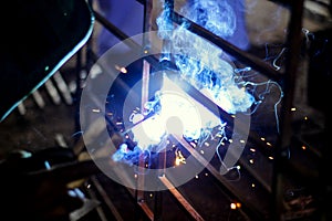 Metal Welding with sparks and smoke. Bright, industry