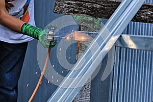 Metal welding. Welding of shiny and dangerous metal structures, workplace safety concept