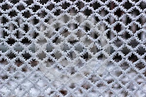 Metal wire-netting covered with frost