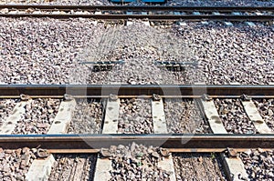 Metal wire pulley system under the railway track.