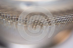 Metal wire round mesh background or texture. Close-up, macro.