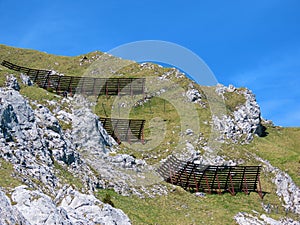 Metal and wooden structures for protection against avalanches on Mount Matthorn in the Pilatus mountain massif, Alpnach