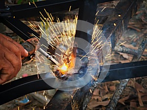 Metal worker doing manual labor, Skilled welder close up.