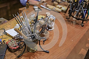 Metal working tools in an artisanal jeweler workshop studio in Florence, Italy