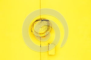 metal yellow doors with a lock abstract background. Monocolor texture pattern with copy space