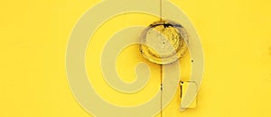 metal yellow doors with a lock abstract background. Monocolor texture pattern with copy space