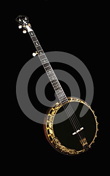 Metalic luxury golden banjo isolated on black background