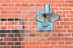 Metall lamp fixed on a brick wall