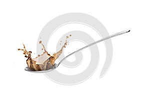 Metall spoon with soy sauce splash