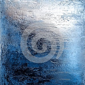 Metallic background with a glossy finish and subtle scratches