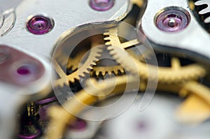 Metallic Background with metal cogwheels a clockwork. Macro