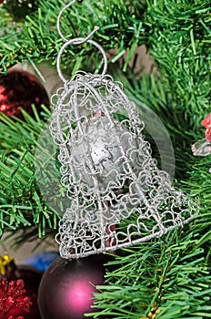 Metallic bell Christmas ornament tree, detail, close up