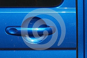 Metallic blue car door handle