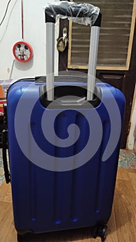 Metallic blue travel suitcase