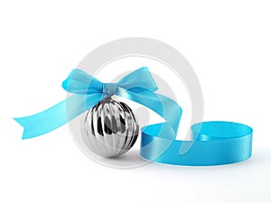 grey glossy chrome christmas ball with spiral light blue isolated on white background