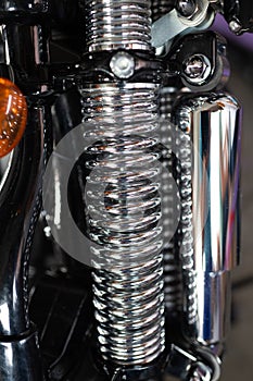 Metallic chrome custom hydraulic shock absorber or rear suspension shock motorcycle part detailed