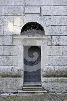 The metallic door of The Bell Tower of Parish Church Santi Filippo e Giacomo Apostoli in Cortina d`Ampezzo.