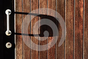 Metallic door handle on old door