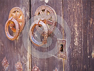 Metallic doorhandle at an old door, Valencia photo