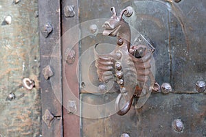 Metallic dragon as handle of door on Orava castle