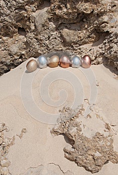 Metallic Easter Eggs on a cliff