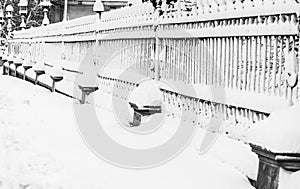 Metallic fence with snow. Metal fence in winter covered with snow. .Snowy environment in the morning