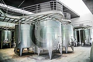 Metallic fermentation tanks in winery Vina Undurraga in Talagante Chile photo