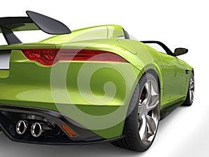 Metallic green luxury convertible sports car - taillight closeup shot