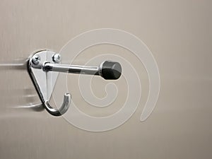 Metallic hook on metallic door
