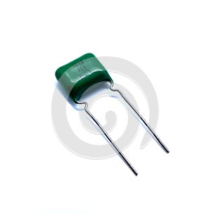 Metallic isolated green capacitor on the white background