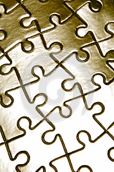 Metallic jigsaw puzzle pieces