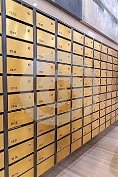 Metallic letter mailbox rows in postal room facilities of condominium