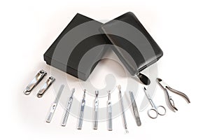 Metallic manicure set with black case on an isolated white background. Beauty salon and tools for nails. Women`s handbag