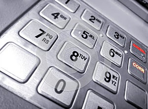 Metallic Numeric Input Keypad on an Automated Teller Machine.