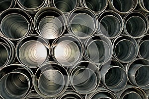 Metallic Pipes stacked in rows pattern