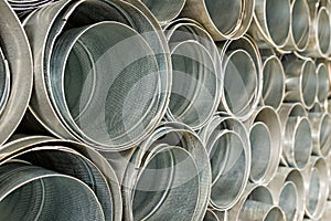 Metallic Pipes stacked in rows pattern