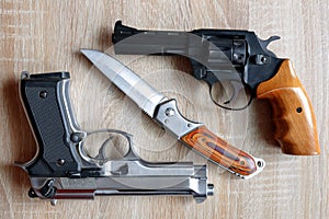 Metallic pistol with knife