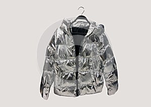 Metallic puffer down jacket. Composition of clothes