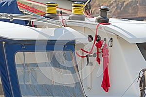 Metallic pulley block and ropes on the deck