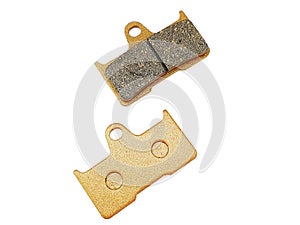 Metallic, rectangular braking pads isolated on white