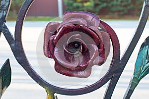 Metallic rose burgundy color, forged floral decoration