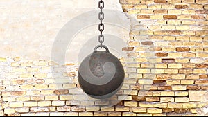 Metallic rusty wrecking ball on chain