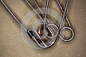 Metallic safety pins