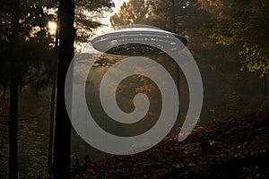 a metallic saucer-shaped object hovering above a dense forest