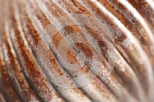 metallic shiny wallpaper.Ribbed metal rusty surface.Ribbed shiny surface.Shabby metal background with traces of rust