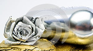 Metallic silver color. Winery concept. Floral wine. Metal flower in steel silver bottle. Forging and sculpture. Silver